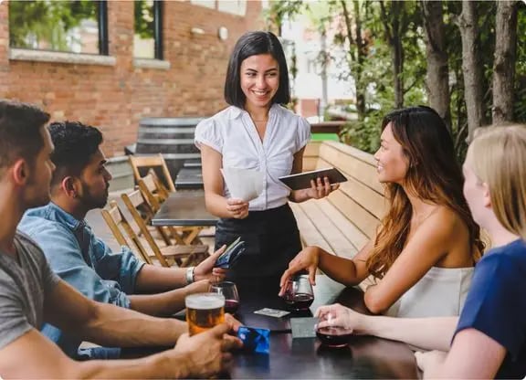 Restaurant staff and scheduling management tools. Happy employee serving guests